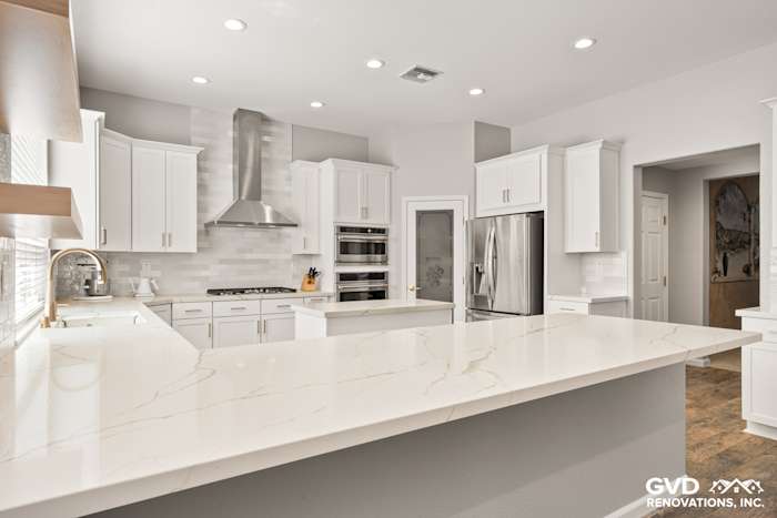 Bright modern kitchen with Diamond cabinets, MSI countertops, and a stainless steel range hood in Roseville, CA