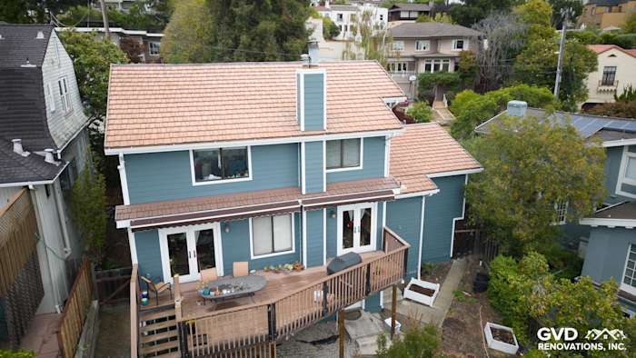Two-story home with Evening Blue Cedarmill HardiePlank siding and Rustic Grain Arctic White trim, overlooking a deck