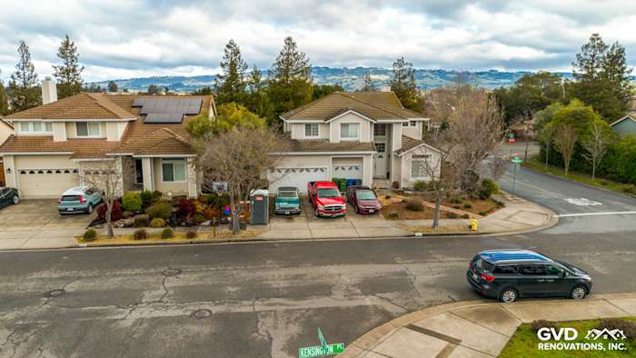 Exterior view of a home in Petaluma, showcasing James Hardie Cobble Stone siding with Arctic White trim