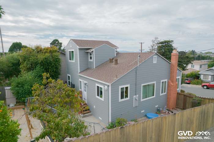 Gray Slate James Hardie siding with Arctic White trim on modern Richmond, CA home exterior, showcasing new windows
