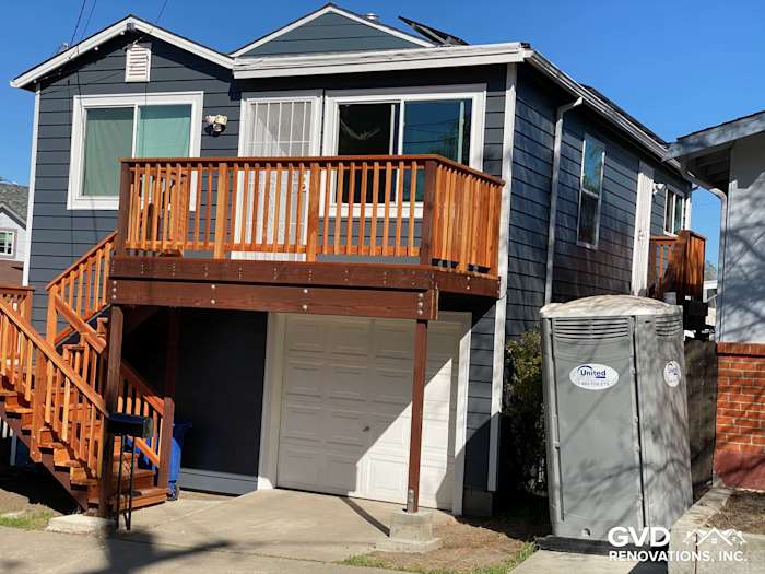 Updated home exterior in Rio Vista showcasing CraneBoard vinyl siding, Anlin windows, and a new wooden deck