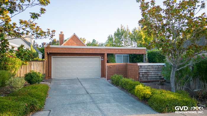 Sonoma home exterior featuring FTX Cedar Sidewall Panel Siding and new Milgard Windows, lush landscaping