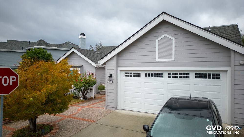 Foster City home exterior featuring new Pearl Gray James Hardie siding and Milgard windows
