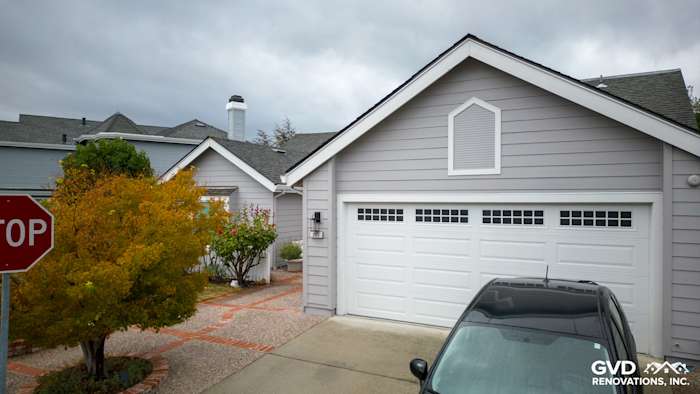 Foster City home exterior featuring new Pearl Gray James Hardie siding and Milgard windows