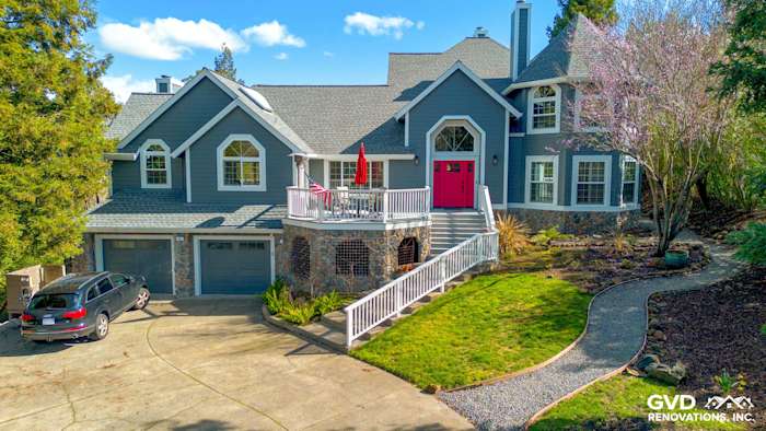 Petaluma home exterior featuring Night Gray James Hardie siding and Arctic White trim with a red front door