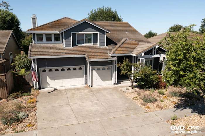 Modern home exterior in Petaluma featuring Night Grey James Hardie siding and Arctic White trim with a clean driveway