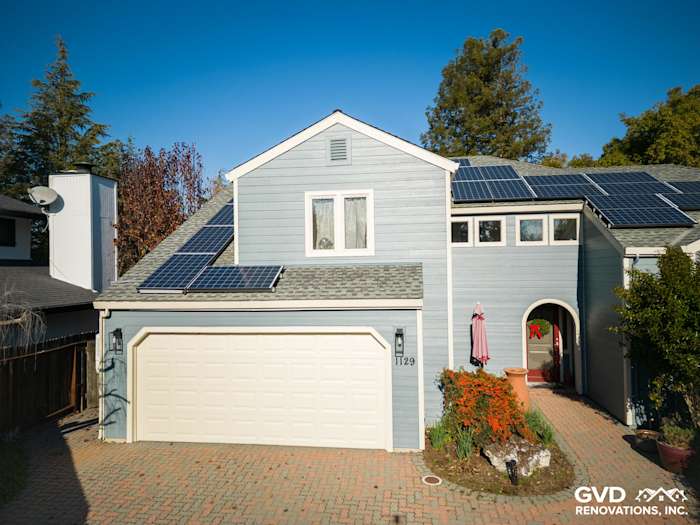 New Boothbay Blue James Hardie siding on a home in Davis with solar panels and paver driveway