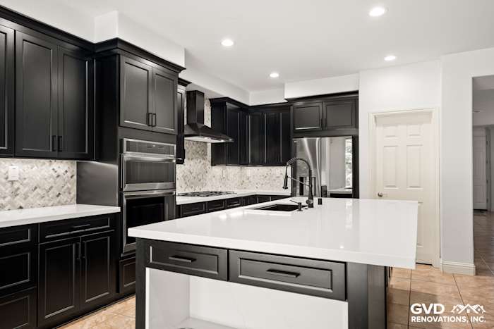 Modern kitchen in Roseville featuring Waypoint cabinets, MSI countertops, and stylish backsplash with mitered edge