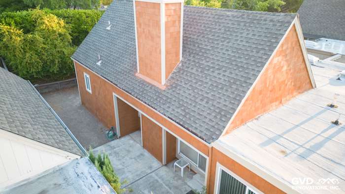 Cedar sidewall panel siding and Milgard windows on a Sonoma home exterior with a prominent chimney