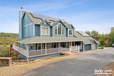 Newly installed blue James Hardie siding on a stylish Shingle Springs home with solar panels