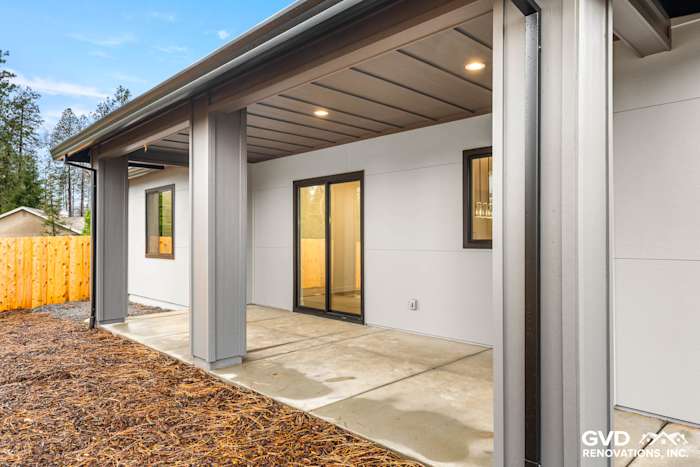 Exterior view of a new home in Paradise, CA, featuring James Hardie panels and Milgard windows