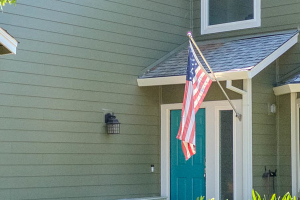 Home exterior in Citrus Heights featuring James Hardie Lap Siding in Mountain Sage with Arctic White trim and vibrant