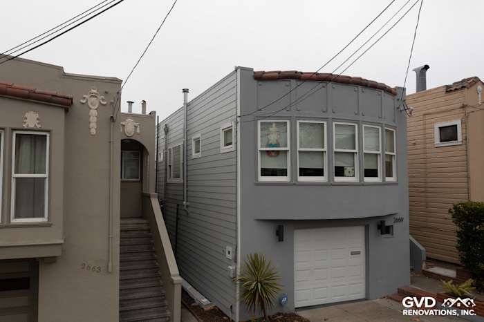 Light Mist James Hardie Lap Siding and Arctic White HardieTrim on a remodeled San Francisco home exterior