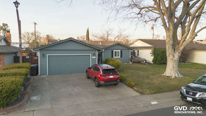 Home exterior featuring Boothbay Blue James Hardie siding, painted eaves, and new gutters in Rancho Cordova