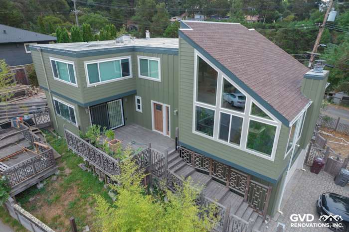 Vertical Mountain Sage siding with CobbleStone trim and new Anlin Catalina windows on modern Oakland home exterior