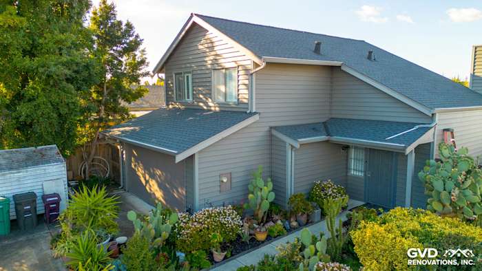 Modern home exterior in Hayward, CA, featuring Alside Prodigy Vinyl siding in Ageless Slate color