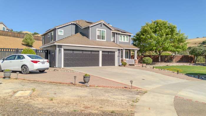 Home exterior featuring James Hardie Lap Siding in Night Gray with Arctic White trim, enhancing curb appeal