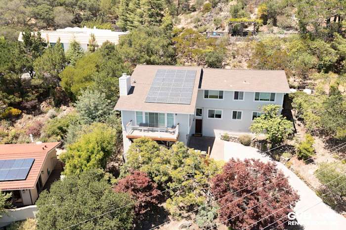 Home exterior with James Hardie siding in Cobble Stone, Arctic White trim, and solar panels in San Rafael