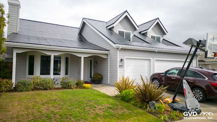 Foster City home featuring Pearl Gray James Hardie siding and Arctic White trim with a landscaped front yard