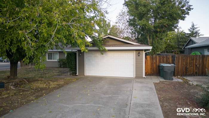 Home exterior featuring new Cobble Stone James Hardie siding and a clean driveway in Orangevale, CA