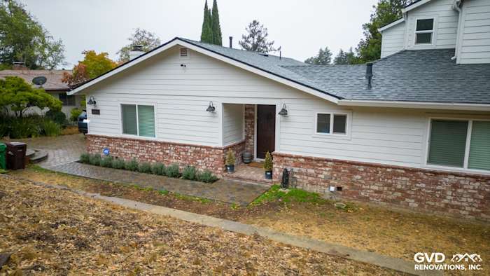 Modern Oakland home featuring James Hardie Cedarmill siding, Alside windows, and a brick foundation