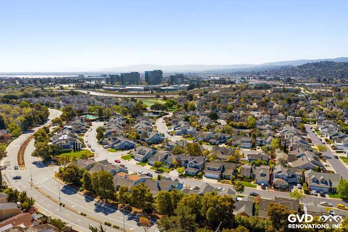 Aerial view of residential area in Foster City, showcasing homes with Boothbay Blue Hardie Siding and Milgard Windows