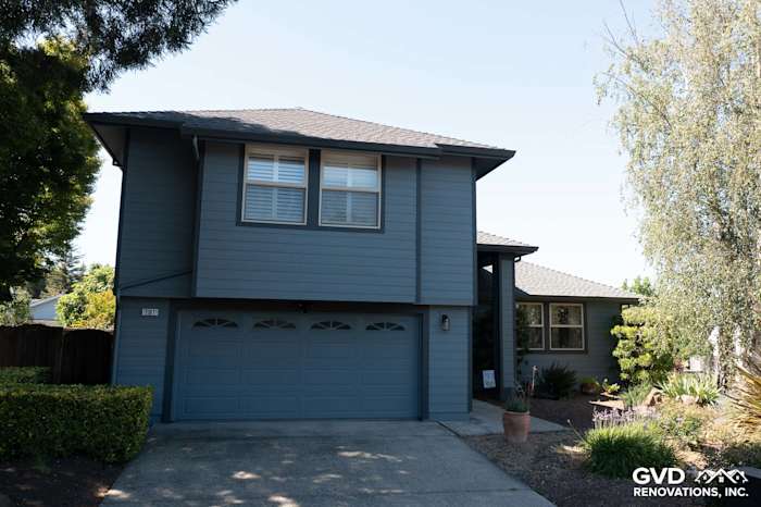 Home exterior featuring Boothbay Blue James Hardie siding and new Milgard windows in Rohnert Park