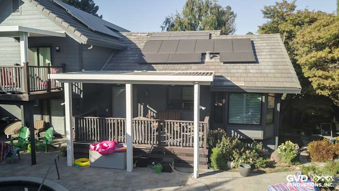 Modern home exterior featuring Night Gray HardiePlank siding and a stylish covered deck in Sacramento