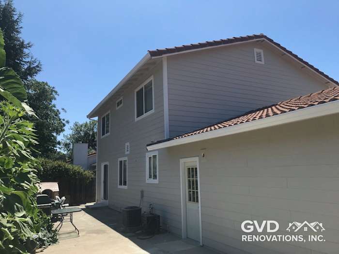 Arctic White James Hardie siding and trim on a home exterior in Concord, showcasing a modern look