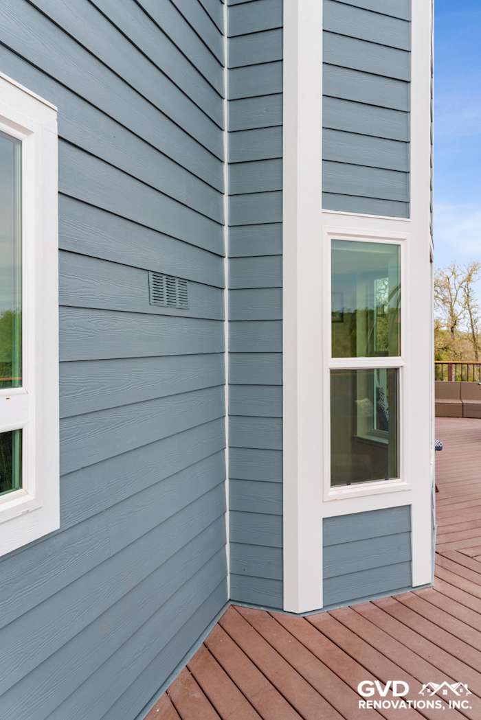 New blue James Hardie fiber cement siding with white trim on Shingle Springs home exterior