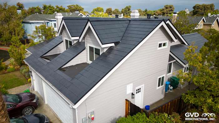 Foster City home featuring Pearl Gray James Hardie siding and Arctic White trim on a modern roof