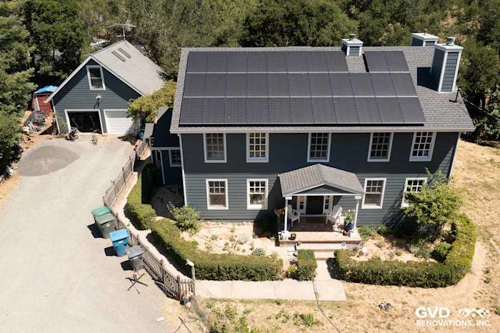 Newly installed Evening Blue James Hardie lap siding with Arctic White trim on a two-story home in Sebastopol