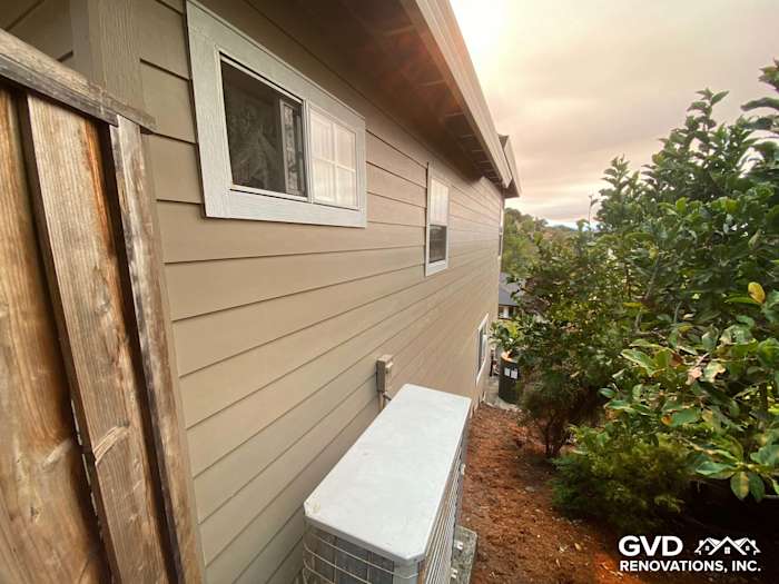 Khaki Brown James Hardie siding on a unique home exterior in Petaluma, CA, with adjacent AC unit