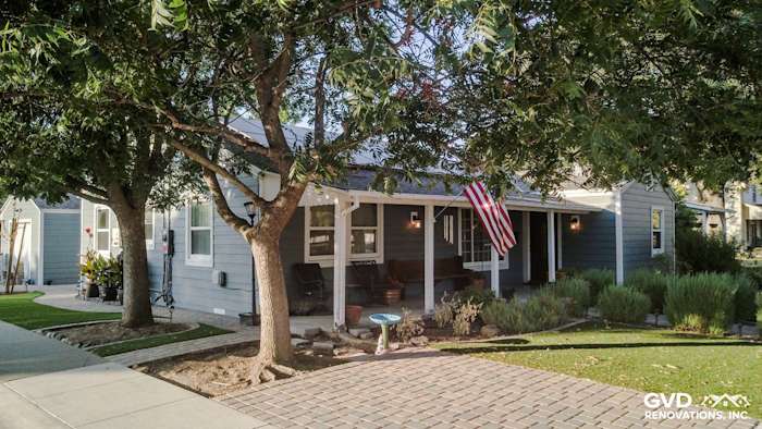 Winters, CA home featuring Boothbay Blue HardiePlank siding and Arctic White trim, surrounded by lush landscaping