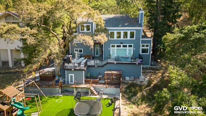Orinda home exterior featuring Night Gray James Hardie siding with Arctic White trim and outdoor deck area