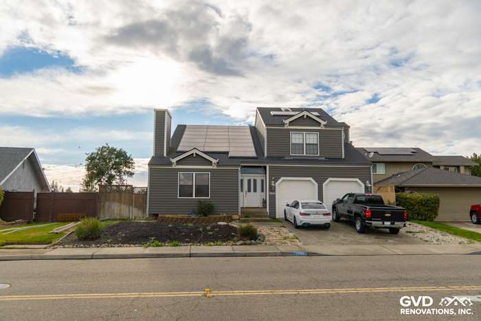Modern home exterior featuring dark gray Prodigy Siding, solar panels, and new landscaping in Stockton, CA