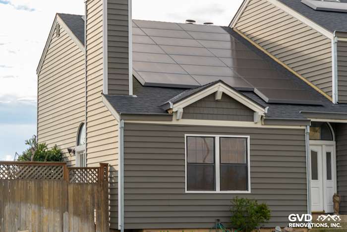 Newly installed Prodigy Siding on a home exterior in Stockton, featuring modern gray panels and solar panels on the roof