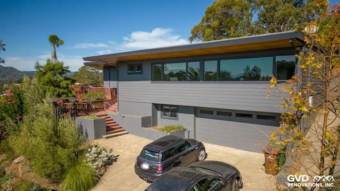 Modern home exterior featuring James Hardie Plank Lap Siding in Night Gray, surrounded by landscaping in San Rafael