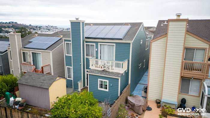 Daly City home featuring Evening Blue HardiePlank lap siding and solar panels on the roof
