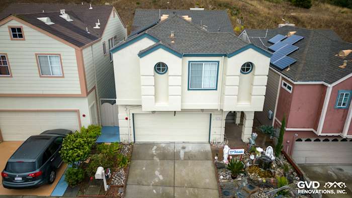 Daly City home showcasing James Hardie Evening Blue lap siding and unique architectural features