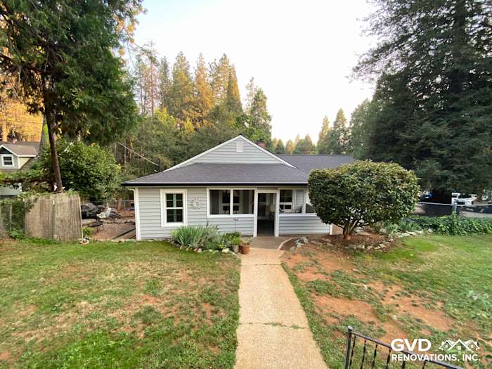 Updated home exterior featuring Prodigy Vinyl Siding in gray, surrounded by greenery in Grass Valley, CA