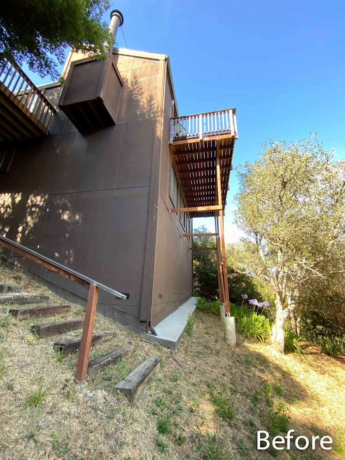 Before shot of a home in Mill Valley with exposed wooden decks and a hillside setting, showcasing future remodel potential