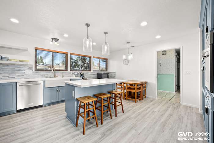 Bright, modern kitchen with Waypoint cabinets, Calacatta Ultra countertops, and Misty Fjord backsplash in Elk Grove