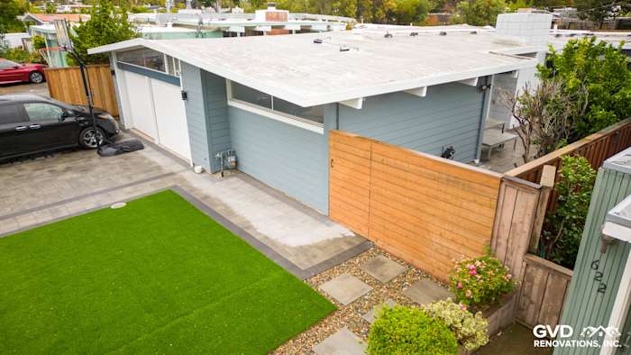 Boothbay Blue James Hardie lap siding with Arctic White trim and landscaped yard in San Mateo, CA exterior renovation