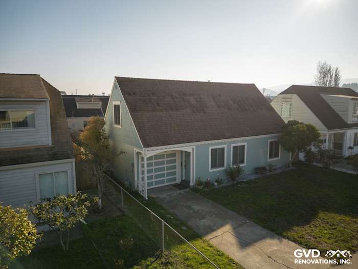 Home exterior featuring freshly installed James Hardie Artisan Lap Siding in a light blue hue
