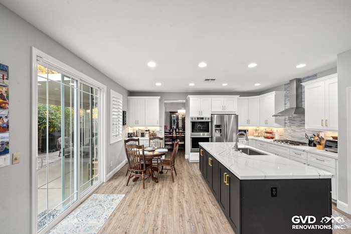 Modern kitchen in Roseville with Cambria countertops, custom cabinets, and wood flooring, featuring ample lighting