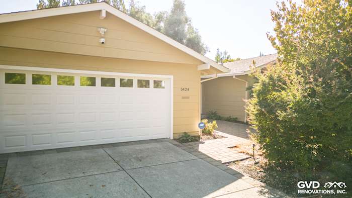 Home exterior in Carmichael with new James Hardie siding, showcasing soft yellow color and modern design