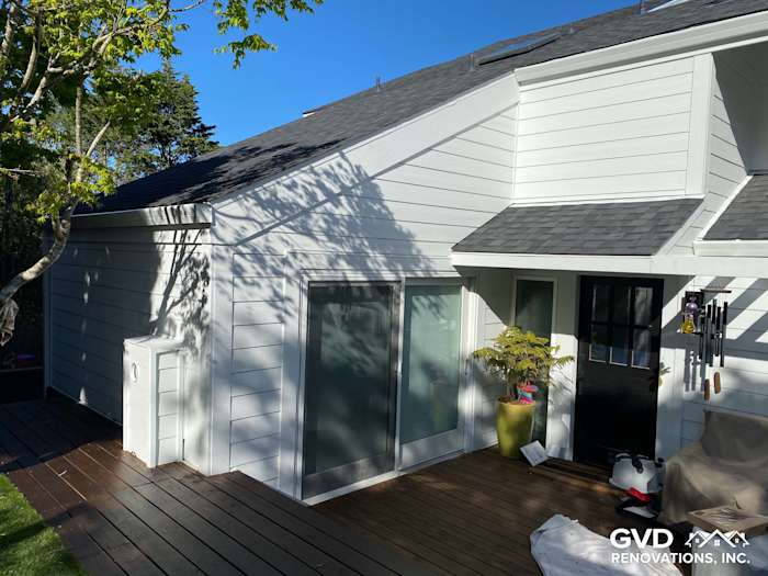 Newly installed James Hardie lap siding on home exterior with deck and modern entryway in Mill Valley, CA