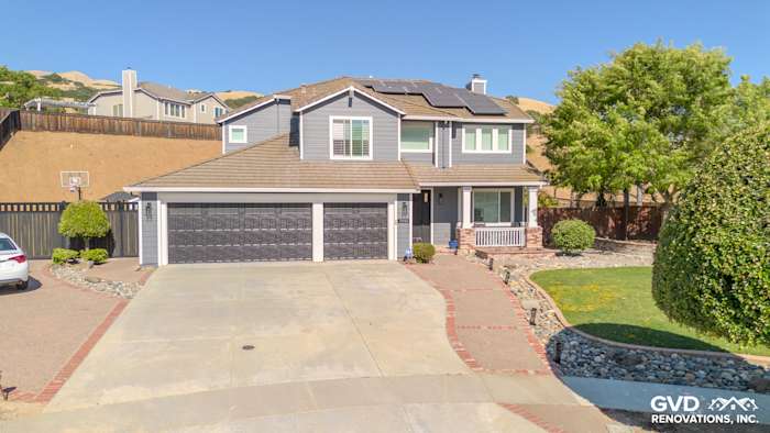 Home exterior featuring James Hardie Lap Siding in Night Gray with Arctic White trim, beautiful landscaping in San Jose