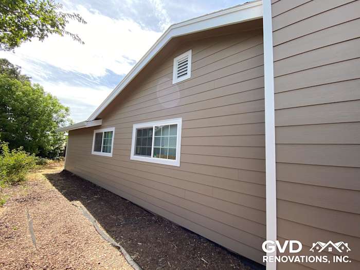 Khaki brown James Hardie lap siding with Arctic white trim on a Fairfield home exterior